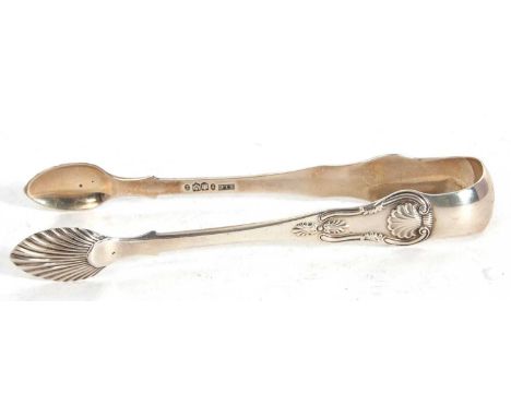 A pair of large Victorian Scottish silver sugar tongs with shell decorated bowls and sides, hallmarked for Edinburgh 1856, ma