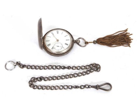 A silver Hunter pocket watch with a silver chain, the pocket watch has a key wound movement and an enamel dial with Roman num