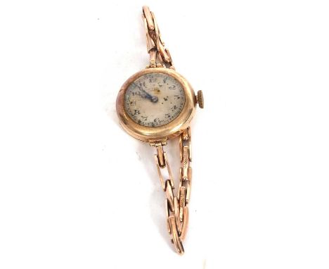 A 9ct gold cased J W Benson lady's wristwatch, the yellow metal bracelet is stamped 9ct, the watch has a crown wound movement