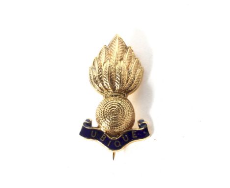 Royal Artillery regimental interest, a 9ct gold and enamel brooch. In the form of a textured gold 'flaming bomb' above a blue