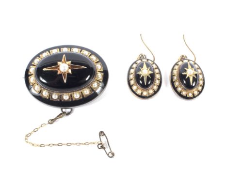 A Victorian black onyx, enamel and half-pearl oval mourning brooch and earring set. Each set with a central oval cabochon bla