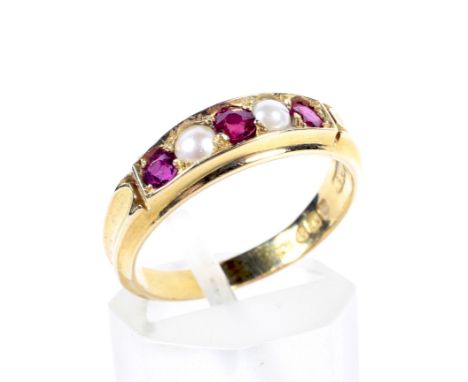 A late Victorian 18ct gold, ruby and half-pearl five stone ring. The three round mixed-cut rubies spaced by half-pearls, all 