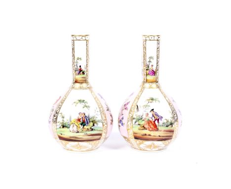 A pair of late 19th century Dresden porcelain bottle-shaped vases. Blue AR marks, painted with bouquets of flowers on a pale-