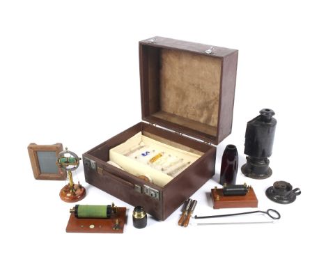 A group of scientific instruments in a case. Including: a Redding &amp; Gyles (London) radio induction coil on wooden mount, 