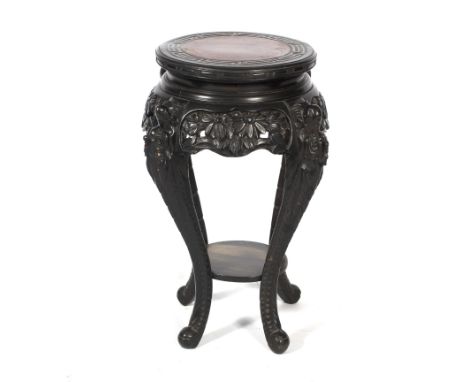 An early 20th century ebonised chinoiserie plant stand. Retailed by J Hunter &amp; Co., Manchester, labelled to the underside