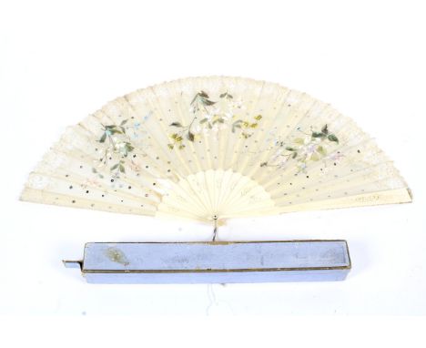 A late 19th century folding fan. With pierced and engraved bone guards and sticks, mounted with a cream chiffon leaf bordered