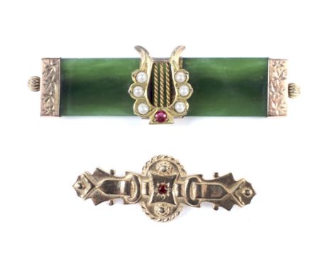 Two gold and gem brooches. Comprising; a vintage 9ct gold and tiny garnet shaped-oblong brooch, marks indistinct, circa 1975(