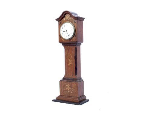 An early 20th century small oak cased marquetry inlaid mantel clock in shape of a longcase. With arched hood inlaid with flow