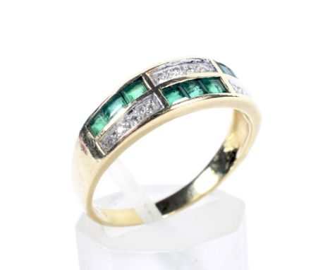 A vintage gold, emerald and diamond two-row dress ring. In the form of alternate calibre emerald three stone and tiny single-