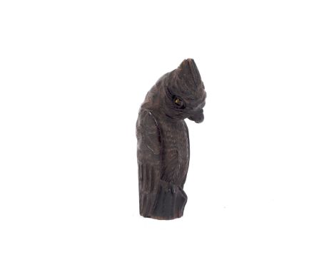 A carved Black Forest walking stick finial, early 20th century. Carved as a cockatoo or parrot with cocked head and amber gla
