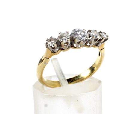 A vintage gold and diamond five stone ring. The graduated early modern-round-brilliants approx. 0.51cts total, all claw set i