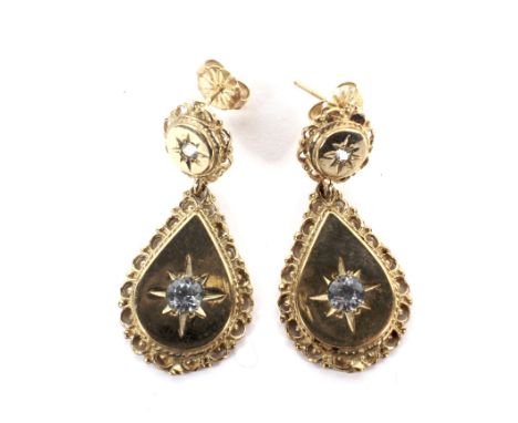 A pair of vintage 9ct gold and aquamarine two stone drop-shaped pendent earrings. Each in the form of a round surmount suspen