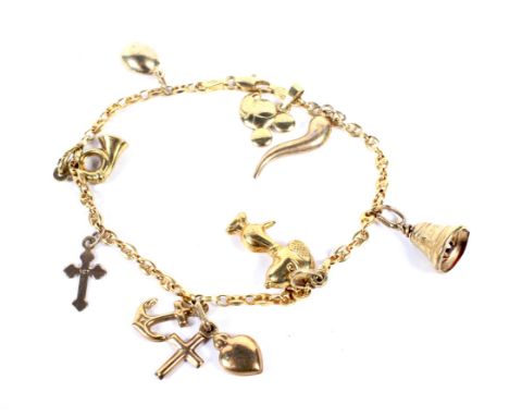 A vintage Italian gold anchor-link 'charm' bracelet. On a lobster-claw clasp, stamped '750', and hung with eight charms inclu