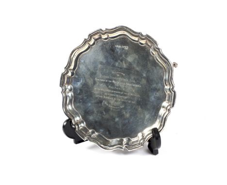 A silver shaped round salver. With a moulded border and engraved with a presentation to celebrate 25 years of marriage, on th