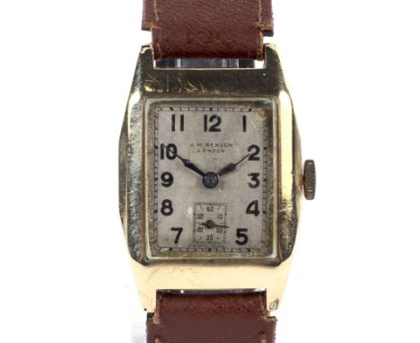 A gentleman's 9ct gold tonneau-shaped wristwatch. Circa 1934, the silvered dial signed 'J. W. Benson, London' and with black 