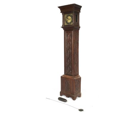 An 18th century 24 hour brass longcase clock movement signed Thomas Cox Thornbury. Mounted in a later carved oak carcass with