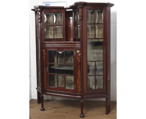 An Art Nouveau mahogany marquetry inlaid glazed cabinet, circa 1900. Inlaid with mother of pearl headed marquetry flowers, wi