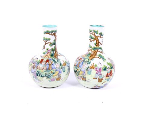 A pair of 20th century Chinese porcelain bottle vases. Each with blue apocryphal Qianlong seal marks, painted in enamels with