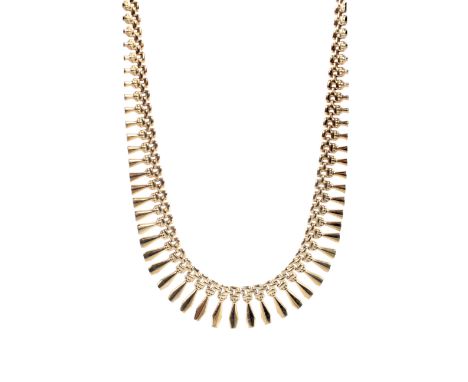 A vintage 9ct gold 'fringe' necklace. In the form of graduated twin tapered batons on a lobster-claw clasp, Birmingham conven