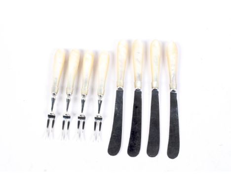 A set of four silver and mother of pearl handled fruit knives and forks. Mark of Mappin and Webb, Sheffield 1903, 310g gross.