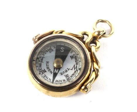An 18ct gold and carnelian round spinning fob compass. Hallmarks for Birmingham 1906, 19mm diameter, 9g gross. Condition Repo