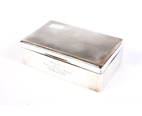 A silver cigar box. The engine-turned hinged-lid engraved with initials 'AJL' within a small rectangular reserve, the plain s