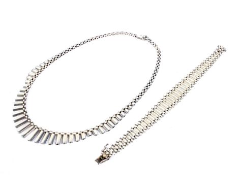A stylish and vintage Italian satinised and polished silver graduated baton-fringe necklace and a similar bracelet. The neckl