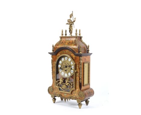 A Louis XV style German (Franz Hermle &amp; Sons) gilt-metal mounted mantel clock. Surmounted with a putto holding a flag, wi