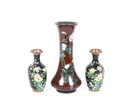 Three 20th century Asian cloisonne vases. The larger Japanese example of tall tapering form, decorated with with flower-spray
