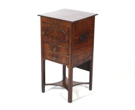 A Georgian mahogany pot cupboard. With later replacement mahogany square top above a panelled cupboard door and two drawers, 