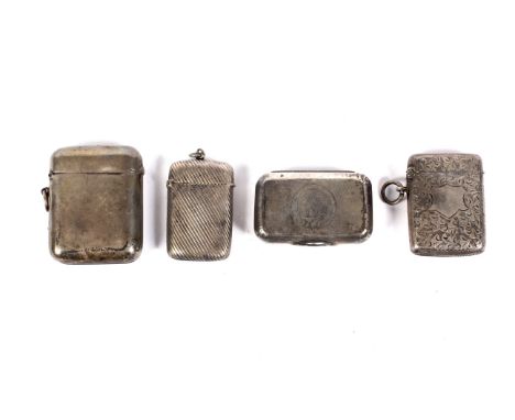 A Victorian silver snuff box and three silver vesta/match cases. The snuff box engraved with a crest and garter within engine