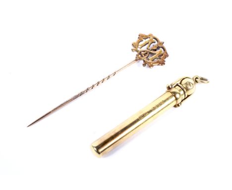 An Edwardian 18ct gold cased propelling pencil and a monogram stick pin. The reeded pencil stamped with a crown and '18', the