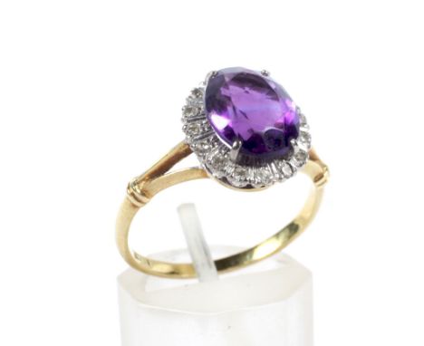 A vintage gold, amethyst and diamond oval cluster ring. Centred with an oval mixed-cut amethyst within an eight-cut diamond 1