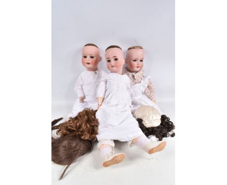 A HEINRICH HANDWERCK BISQUE HEAD DOLL, nape of neck marked 'Germany Henrich . Handwerck Simon &amp; Halbig with two small hol