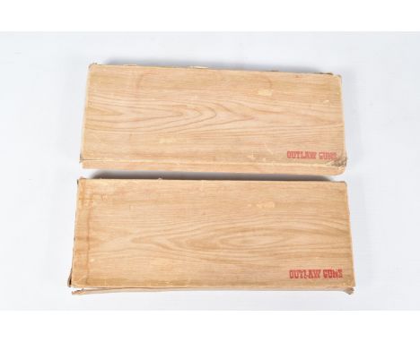 TWO BOXED BCM OUTLAW CAP GUN SETS, each box contains two replica calibre - 44 revolvers signed Apache, each with a star detai