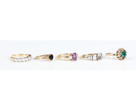 A 9ct gold and aquamarine five stone ring, ring size approx L, a 9ct gold, amethyst and colourless gem set three stone ring, 