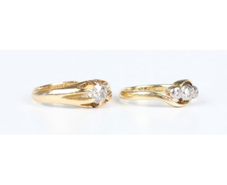 An 18ct gold and diamond single stone ring, claw set with a cushion cut diamond, London 1918, ring size approx N1/2, and an 1