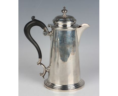 A George V silver tapering cylindrical hot water pot with domed hinged lid and knop finial, on a circular stepped foot, Sheff