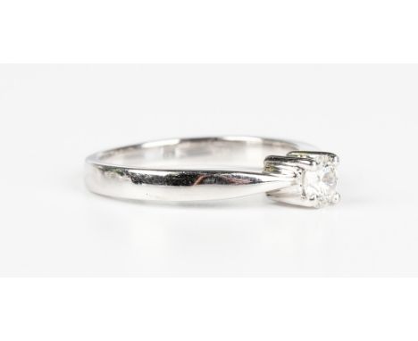 A white gold and diamond single stone ring, claw set with a circular cut diamond, detailed '375 9K', weight 2.7g, ring size a