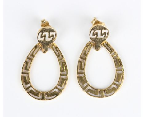 A pair of gold horseshoe shaped earrings, each with an openwork geometric design, detailed '750', with post and butterfly fit