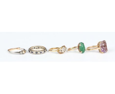 A gold and diamond ring in a foliate crossover design, mounted with rose cut diamonds, unmarked, weight 2.3g, ring size appro