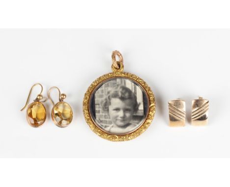 A pair of gold and citrine single stone earrings, each spectacle set with an oval cut citrine, detailed '9ct', length 2.3cm, 