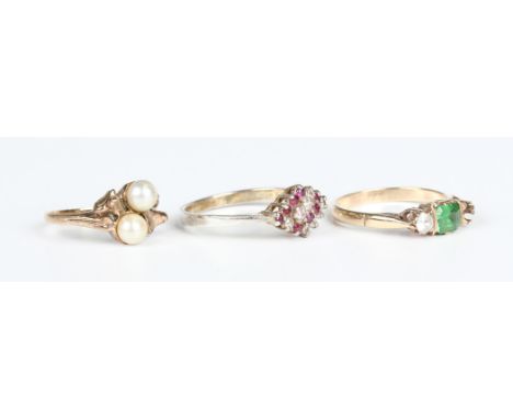 A 9ct gold ring, mounted with two cultured pearls, ring size approx G1/2, a 9ct gold, green and colourless gem set three ston