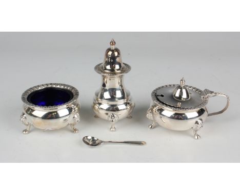 An Elizabeth II silver matched three-piece condiment set of squat circular form with gadrooned rims, raised on lion mask shou