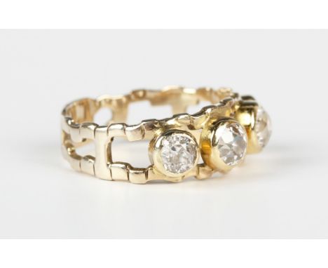 A 9ct gold and diamond ring in a pierced abstract design, mounted with a row of four cushion cut diamonds, weight 4.3g, total