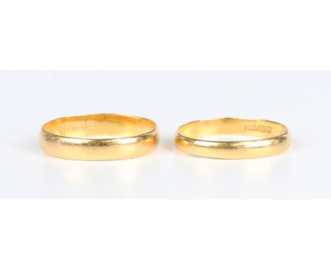 Two 22ct gold wedding rings, London 1919, ring size approx T, and London 1958, ring size approx R, total weight 5.6g.Buyer’s 