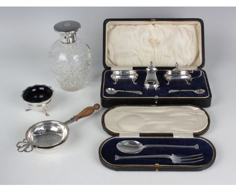 A George V silver three-piece condiment set, Birmingham 1923 by Adie Brothers Ltd, cased, together with a small group of othe