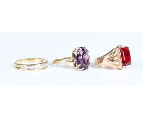 A gold ring, claw set with an oval cut amethyst, detailed '9ct Jaye', ring size approx M, a 9ct gold and cubic zirconia half-