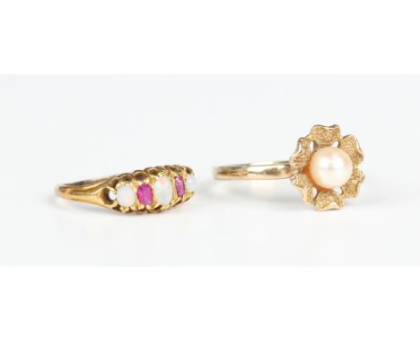 A gold, opal and ruby five stone ring, mounted with three opals alternating with two cushion cut rubies, unmarked, weight 2g,