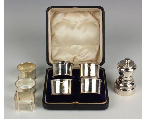 A set of four George V silver napkin rings, each with cast foliate rims, Chester 1913 by James Deakin &amp; Sons, cased, and 